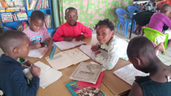 The children do homework in the library.